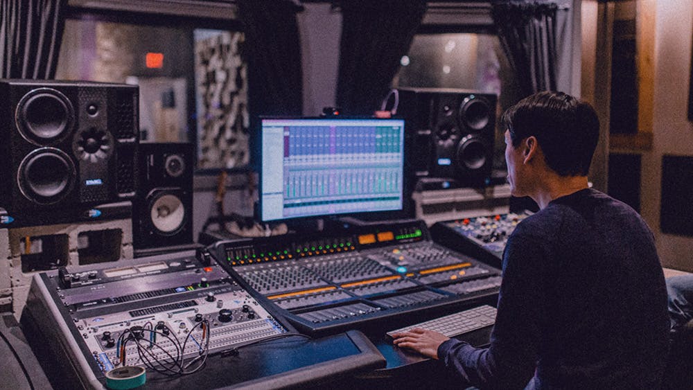 Edmonton based music producer Randor Lin working on a production with artist Jenna Soroka at Velveteen Music's edmonton recording studio