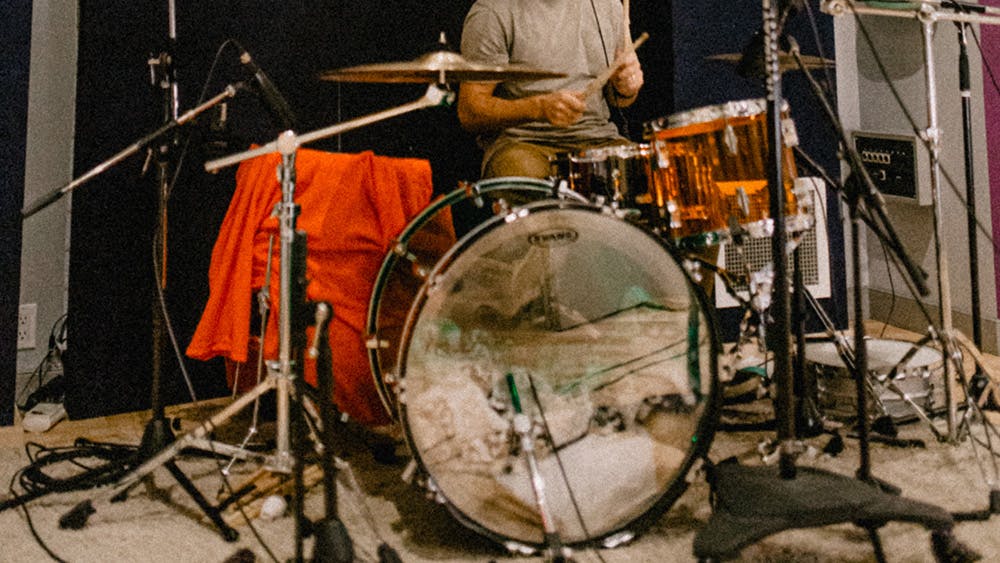 Musician Bradley J Simons playing drums at Edmonton Recording Studio Velveteen Music