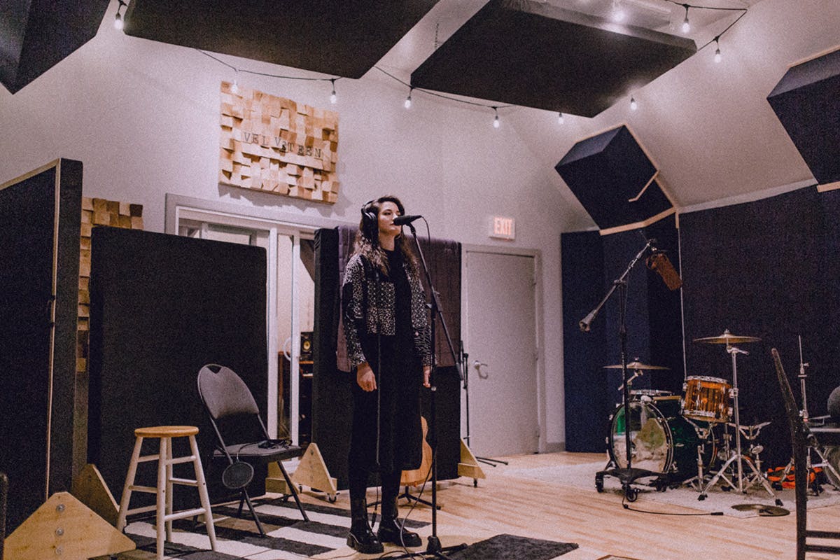 Artist Alex Dawkins tracking vocals on a Sennheiser MD421 microphone at Edmonton Recording Studio Velveteen Music
